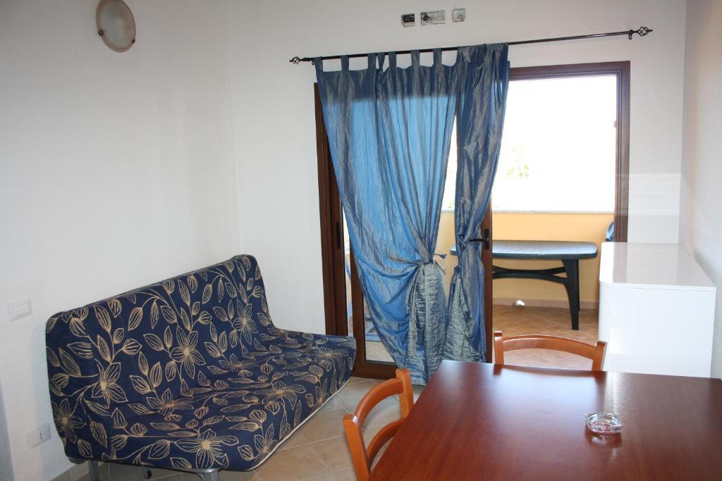 Appartamenti Ideal Isola Rossa Ruang foto