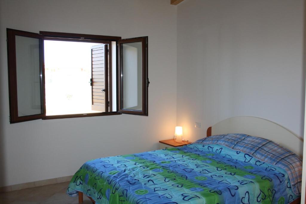 Appartamenti Ideal Isola Rossa Ruang foto